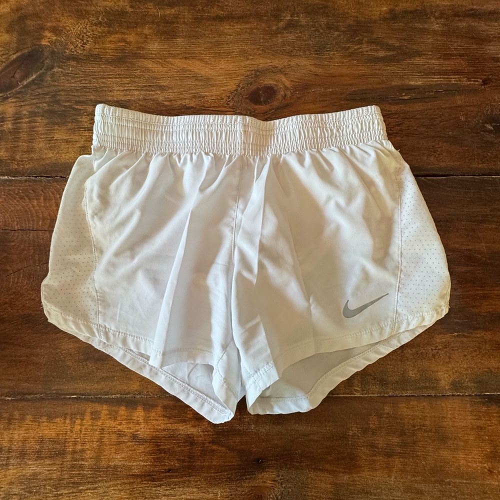 Nike Women's White Athletic Shorts with Silver Logo